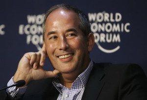Reuters CEO Glocer smiles during a session of the World Economic Forum in Davos